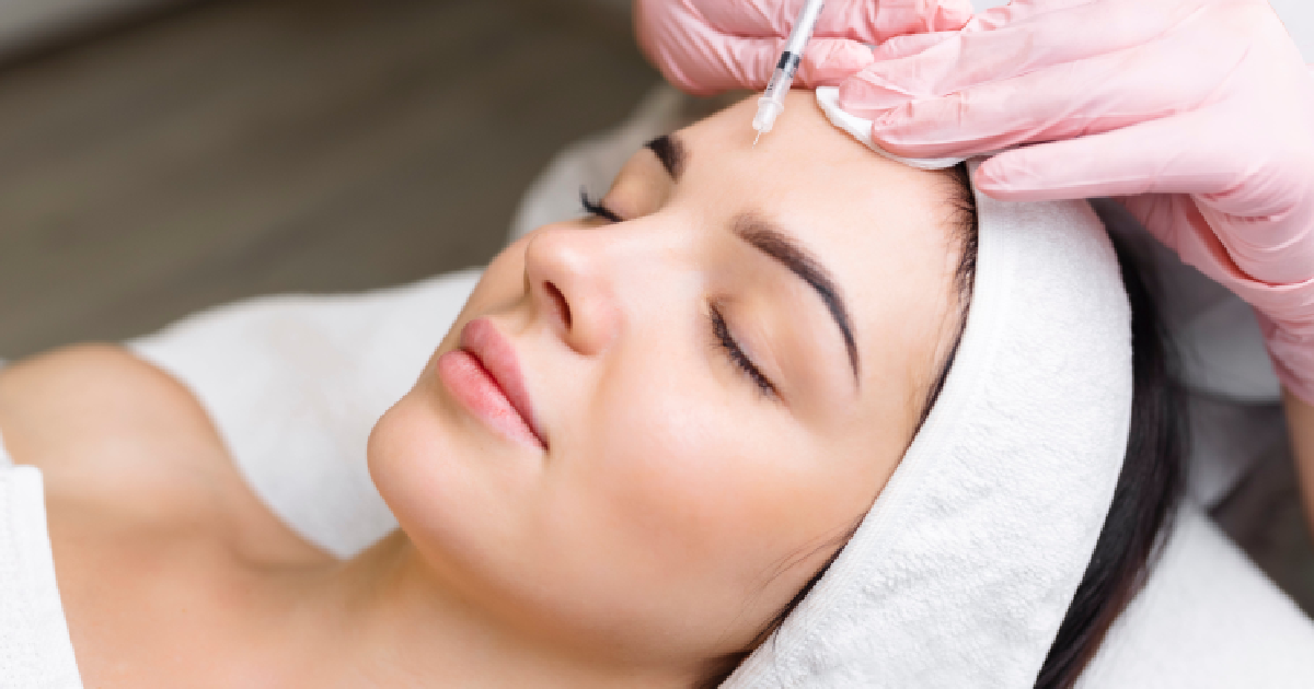 Woman receiving forehead injections as part of Neurotoxin Treatments in Roswell, GA